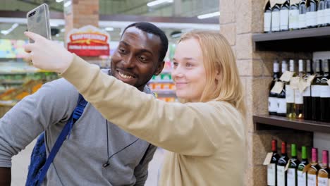 couple taking a selfie in a grocery store