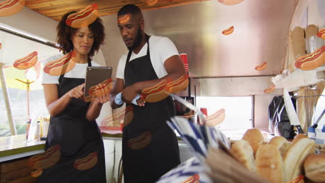 hot dog animation over two people in food truck using tablet