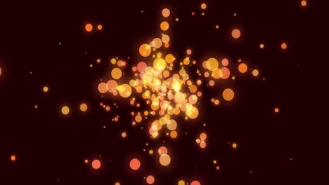 orange and yellow glowing translucent circles effervescing on a dark background