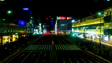 night lapse near station at shinjuku south side wide shot tilt up