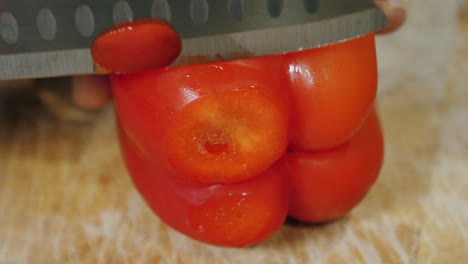 Motion-controlled-slow-motion-shot-of-cutting-red-paprika