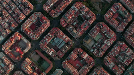 diagonal slider top down drone shot of barcelona grid city square blocks