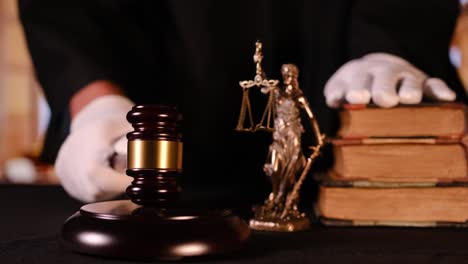 judge announces verdict by hitting gavel. focus on gavel and hammer. cinematic shot of dramatic acquittal