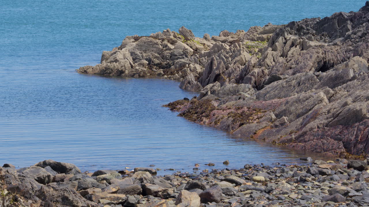 Wide shot of rocks at low tide at stinking port, boat rocks. Isle head, Isle of Whithorn.