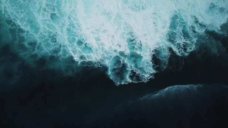 Aerial view of a big wave crashing onto the rough seas found on the North Shore of Oahu, Hawaii
