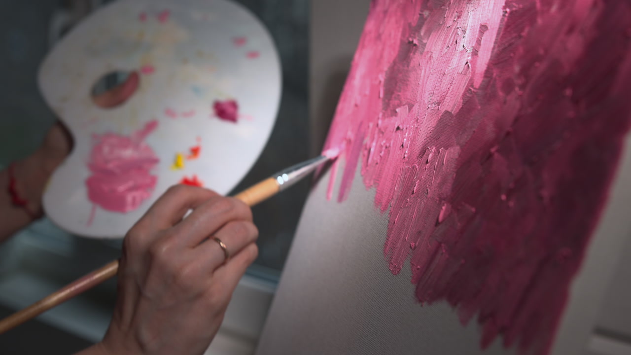 Hand Mixing Paint On Palette And Applying Bold Pink Strokes To Canvas During Focused Studio Session Palette . Media