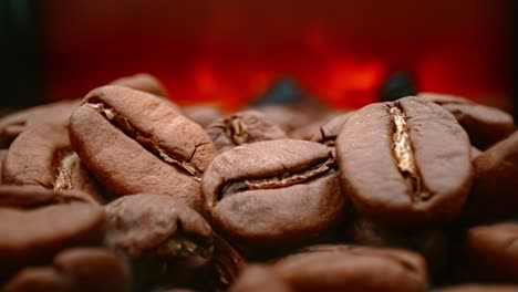 close up of seeds of coffee. fragrant coffee beans are roasted smoke comes from coffee beans.