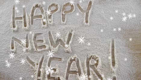 Snowflakes-falling-against-Happy-New-Year-text-written-in-snow