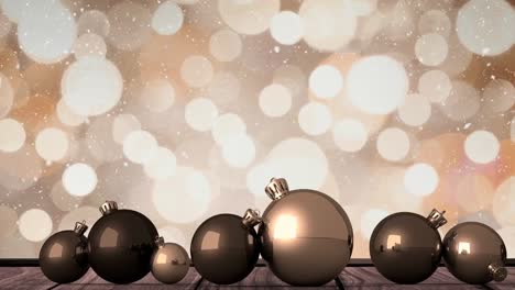 Animation-of-snow-falling-over-christmas-baubles