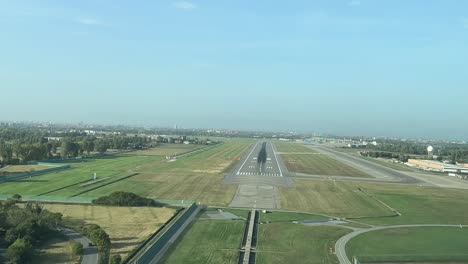 real time landing as seen by the pilots in a sunny summer moorning