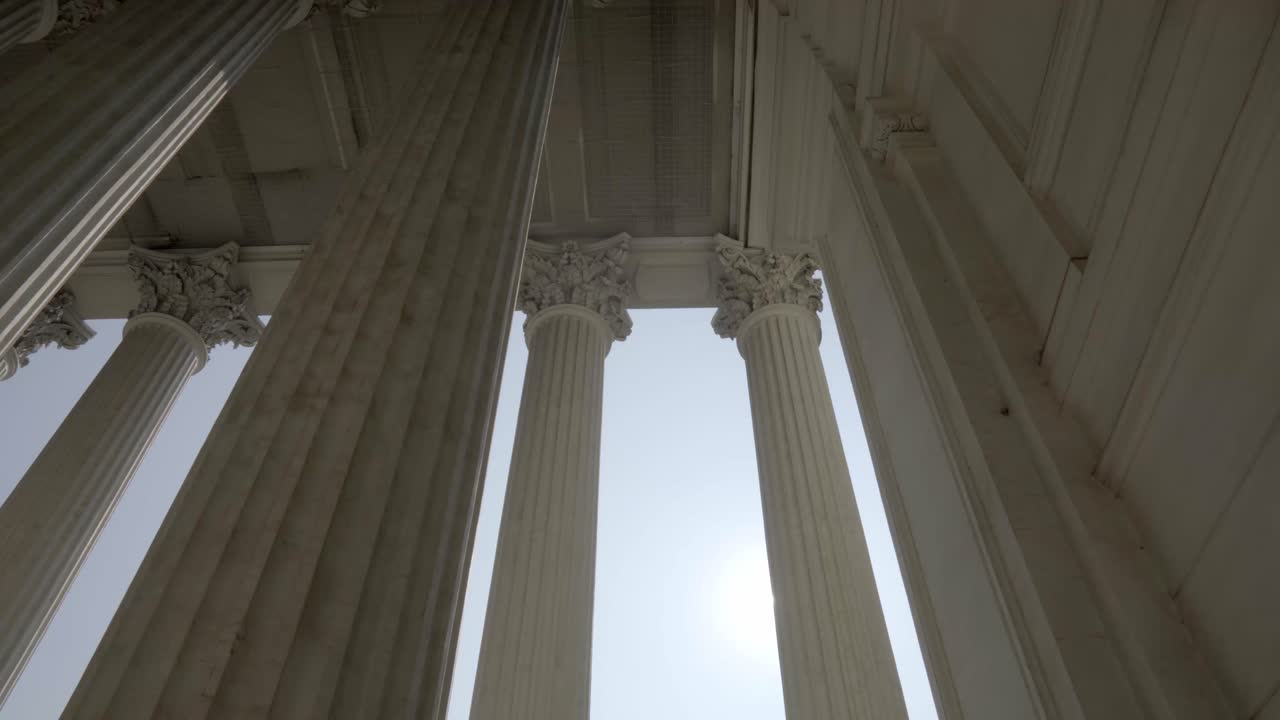Majestic Classical Columns Bathed in Sunlight