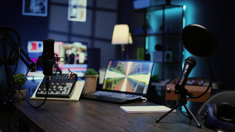 desk in empty studio with podcast gear technology