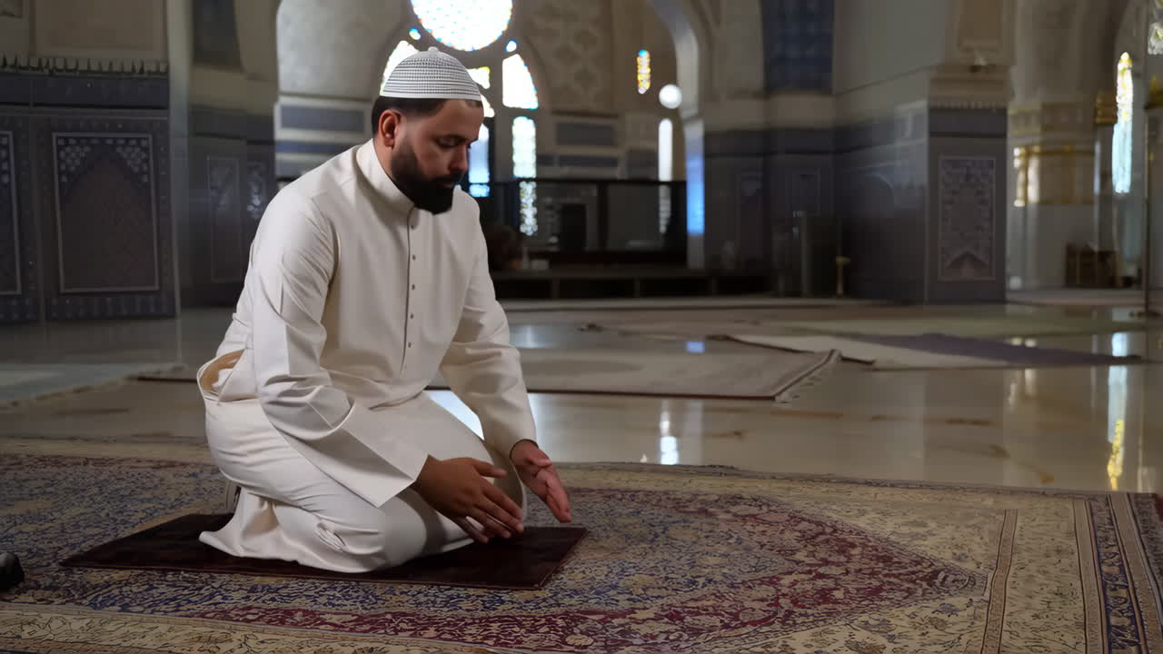 Muslim man performing prayer in a mosque