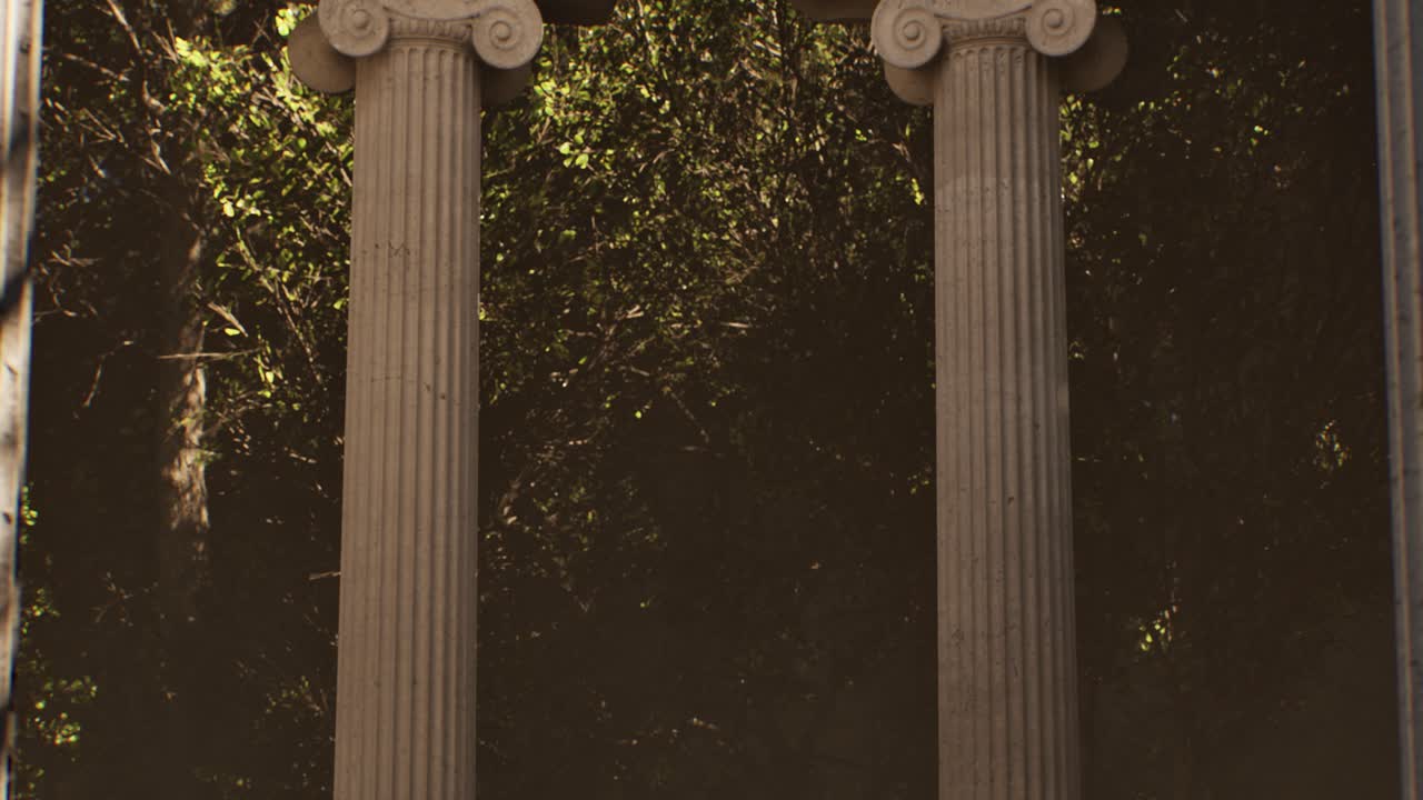 Ancient greek ionic order columns in a lush green forest