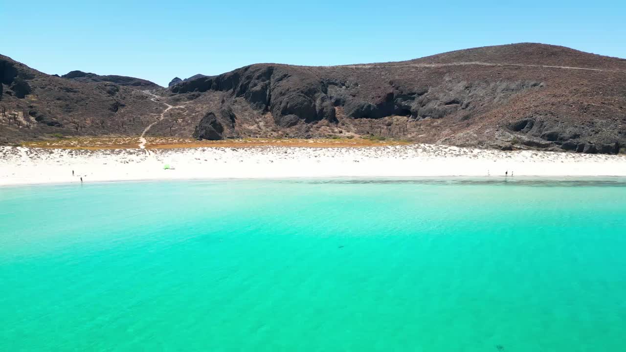 Crystal clear turquoise waters at Tecolotito Beach in La Paz, Mexico