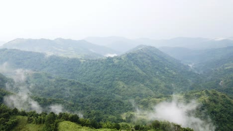 aerial shot view of mountains peaks with clouds landscape