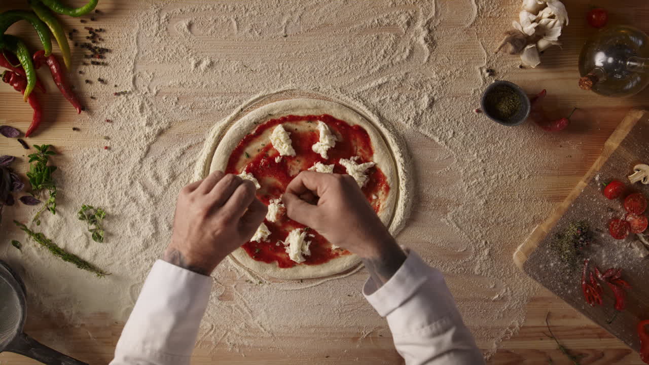 Premium stock video - Pizza cook making food on kitchen table. chef ...