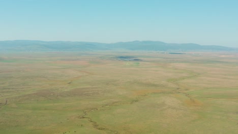 grassland pastures in serbian highlands, high aerial view over prairie plains