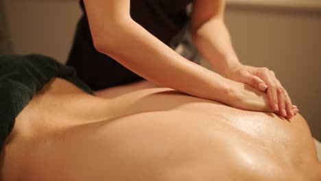 professional massage therapist performing relaxation massage