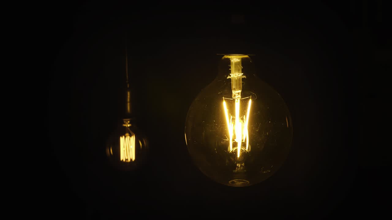 Edison lamps, Vintage light bulb pulsing light in the darkness.