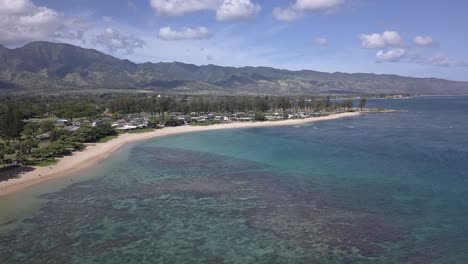 aerial view of haleʻiwa beachfront homes in oahu hawaii on a sunny day