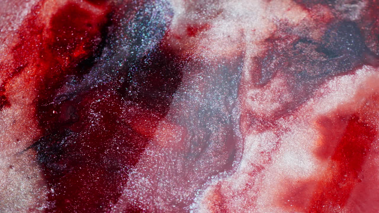 Ink fluid moving densely in a water background. Macro view