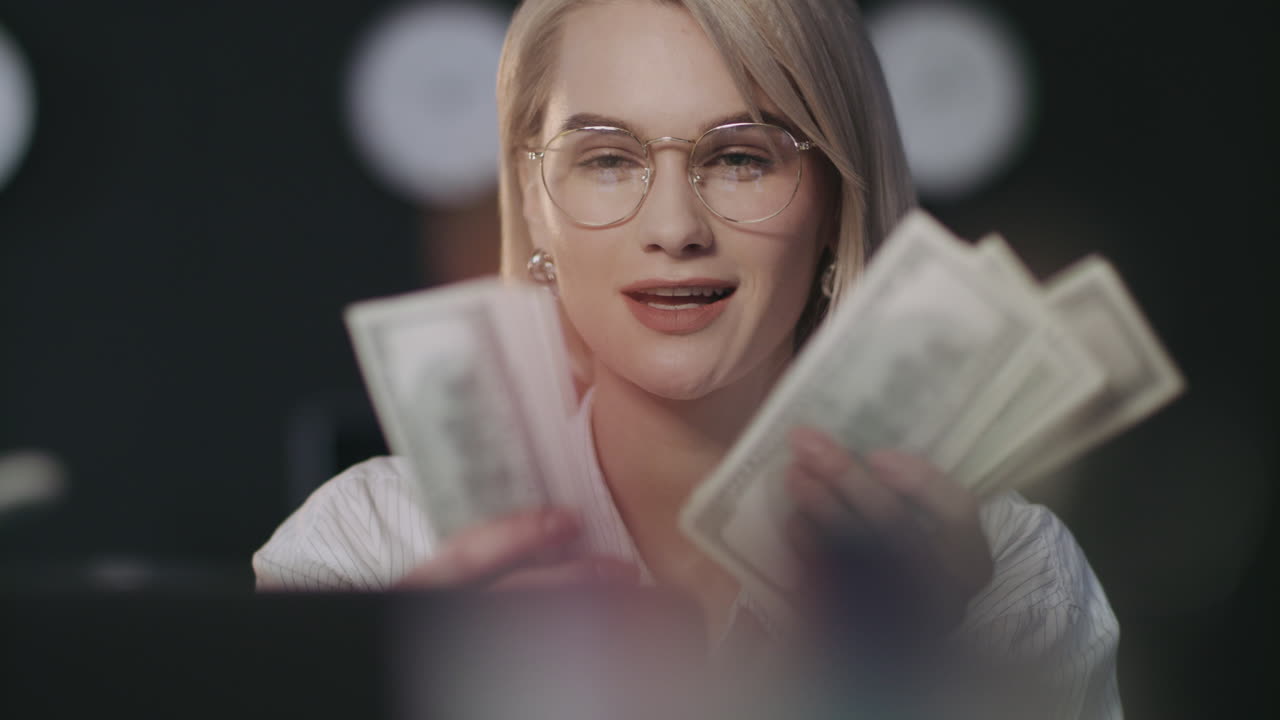 Satisfied business woman counting money cash
