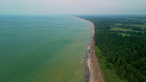 drone establishing shot over the jūrkalne seashore coastline