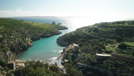 aerial: magrr ix-xini filled with bright sun rays near mediterranean sea