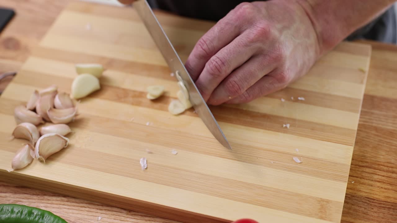 Preparing garlic on a cutting board