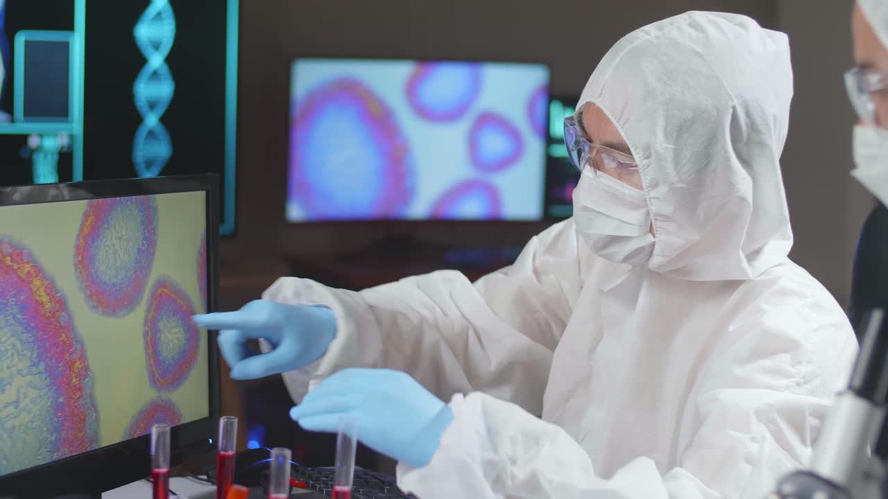 Asian Team Of Scientists Is Working On A Vaccine In A Modern Scientific Research Laboratory. Genetic Engineer Workplace