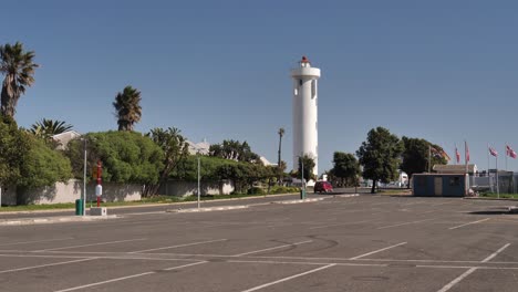 cars drive to white milnerton lighthouse in cape town, south africa