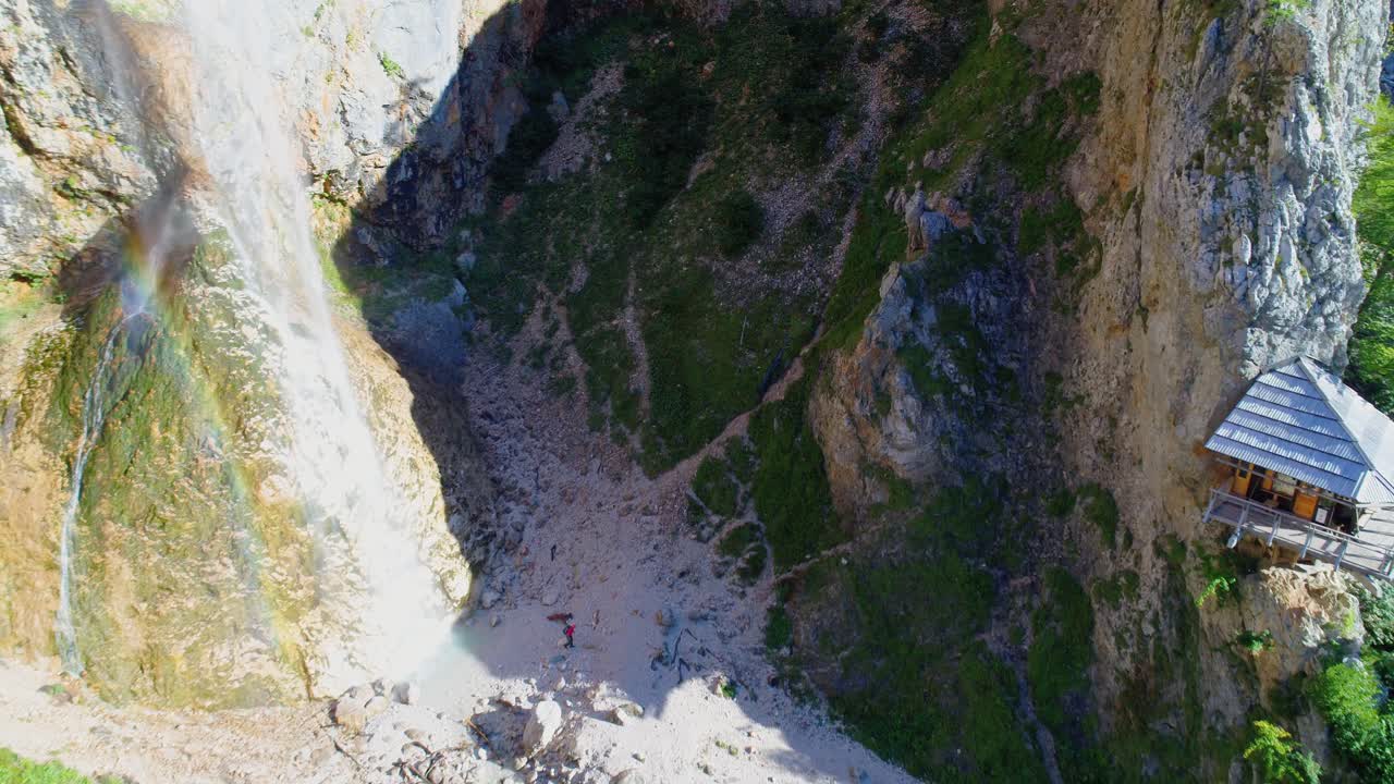 Aerial top raising view of waterfall Rinka in Logar valley, Slovenia