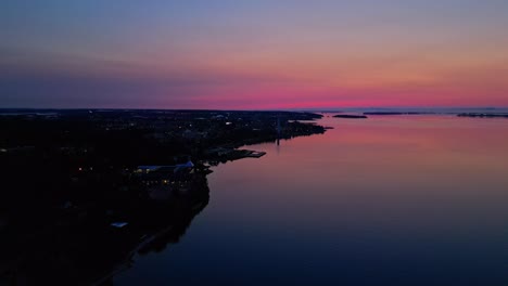 aerial of red glow sunrise over a calm lake