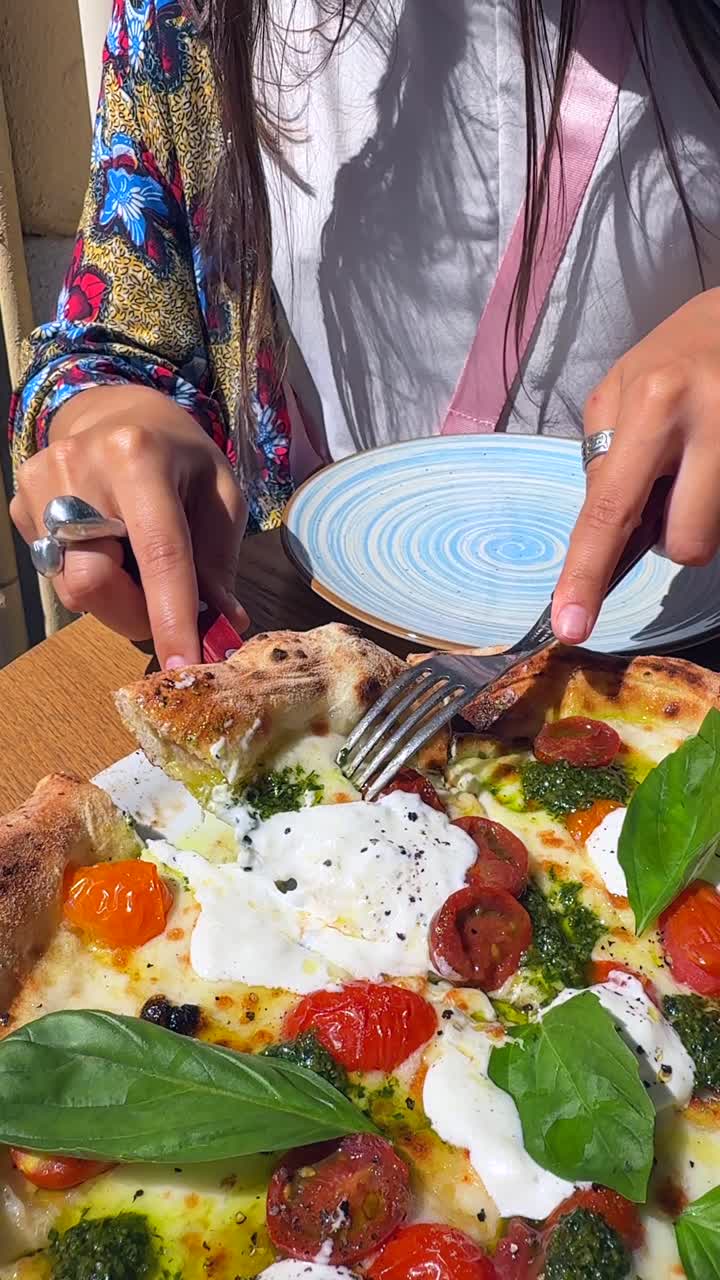 Woman eating a delicious pizza