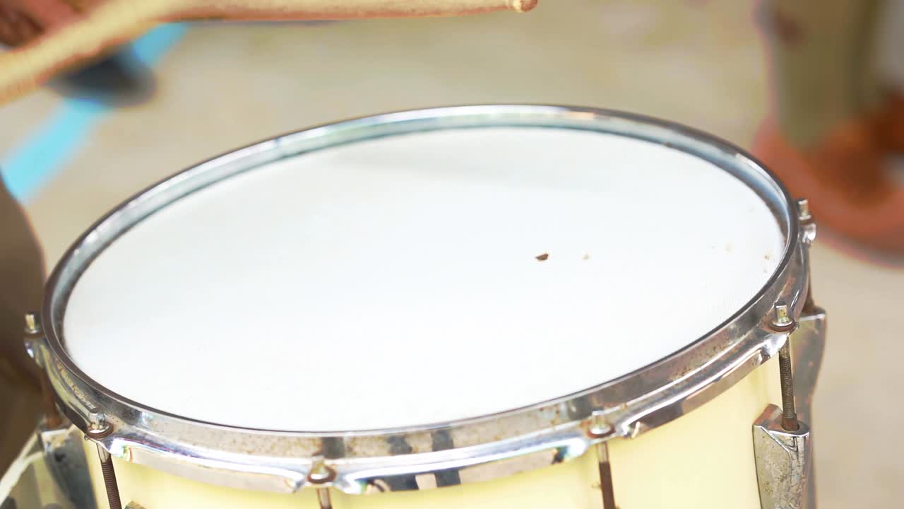Drummer hitting drum slow motion