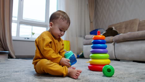 baby playing with stacking rings