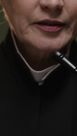 woman speaking into microphone