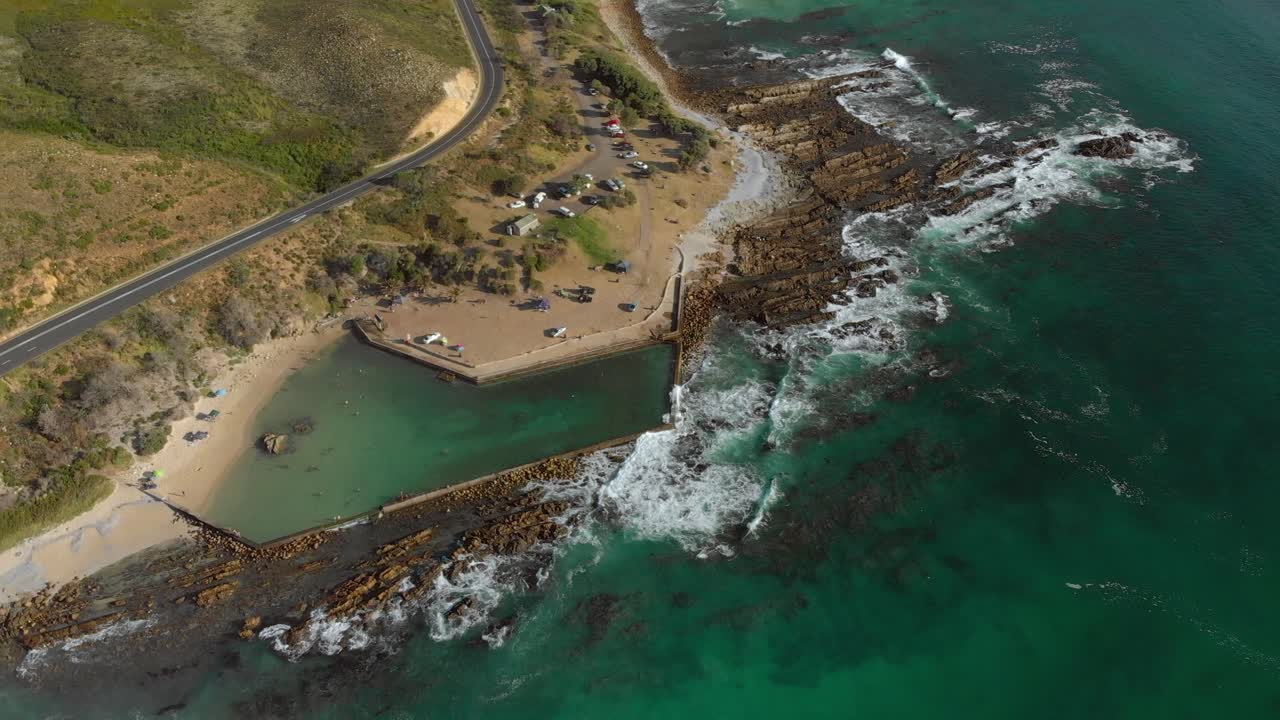 Aerial view of ocean rock pool on a rocky shoreline