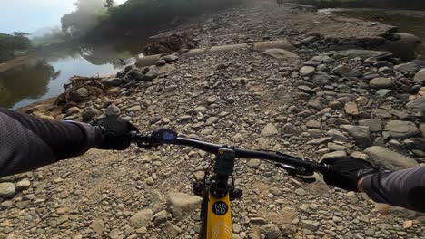 bikers on electric mountain bikes on extreme rough terrain at los mogotes, dominican republic