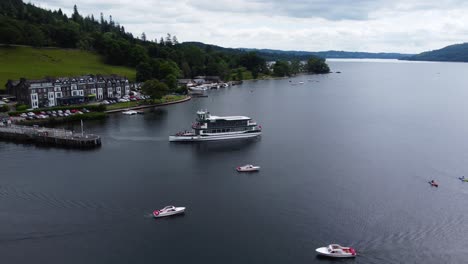 passenger lake tour cruise ferry leaving dock at waterhead marina, ambleside, windermere lake, lake district