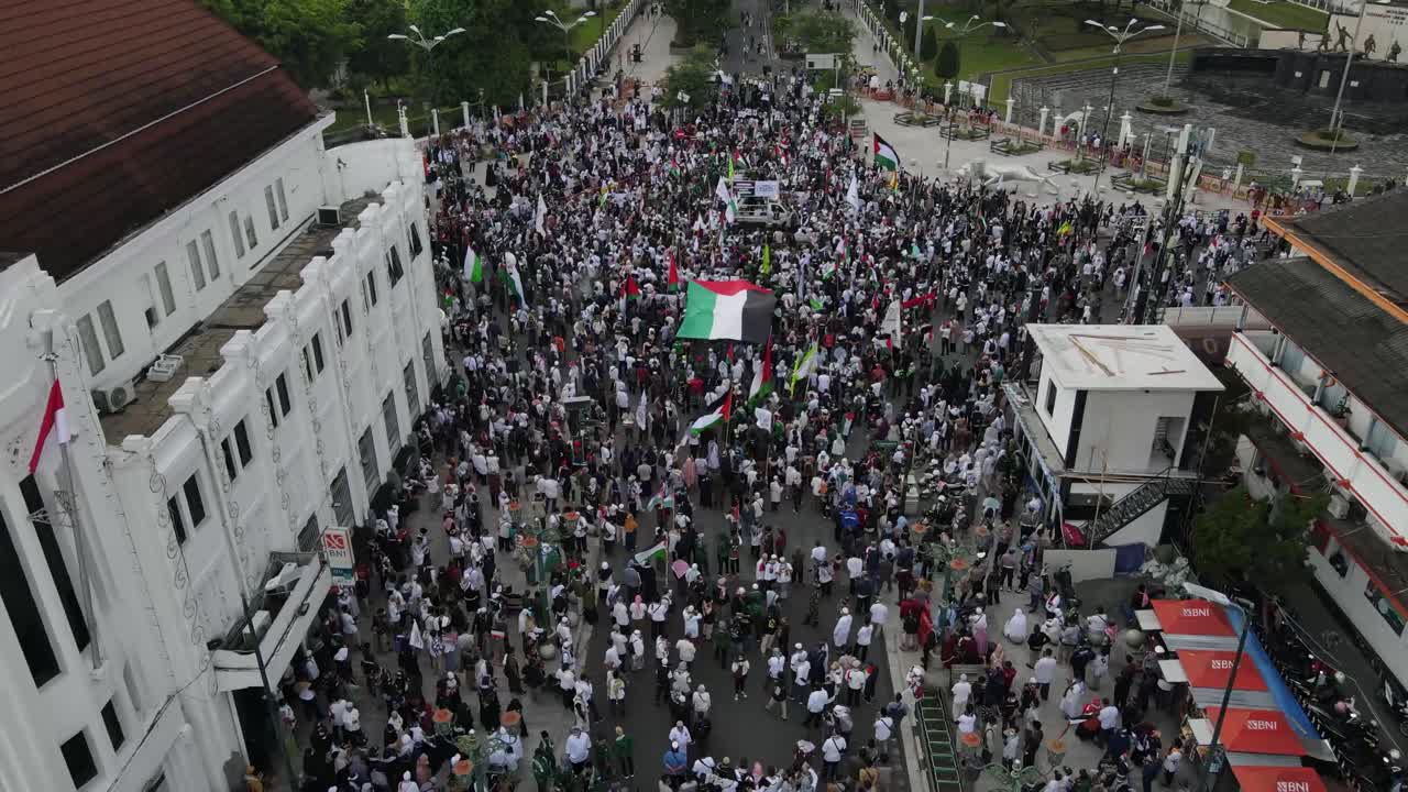 Aerial view, street action or demonstrators supporting Palestinians for freedom and also Palestinian donations in the center of Yogyakarta City, Zero Kilometers.