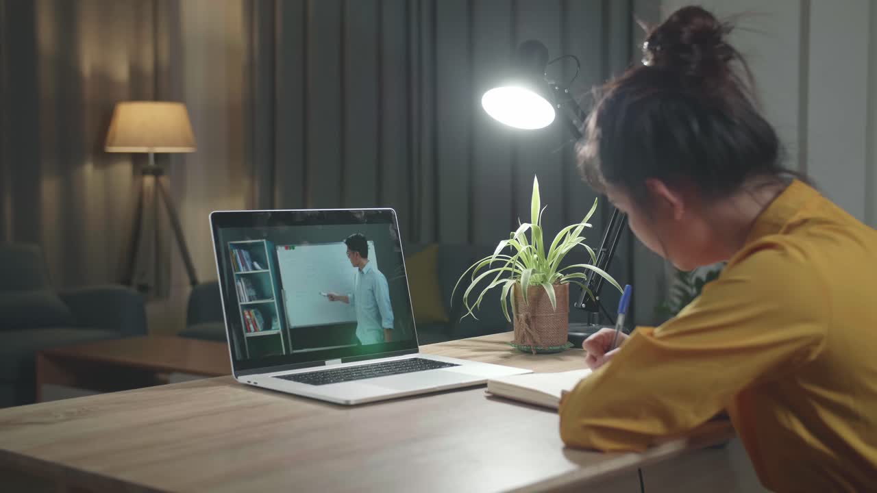 Girl Student Distance Learning With Online Teacher On Computer Screen. Web Tutor Gives Remote Class Teaching Teenage Pupil Elearning From Home At Night