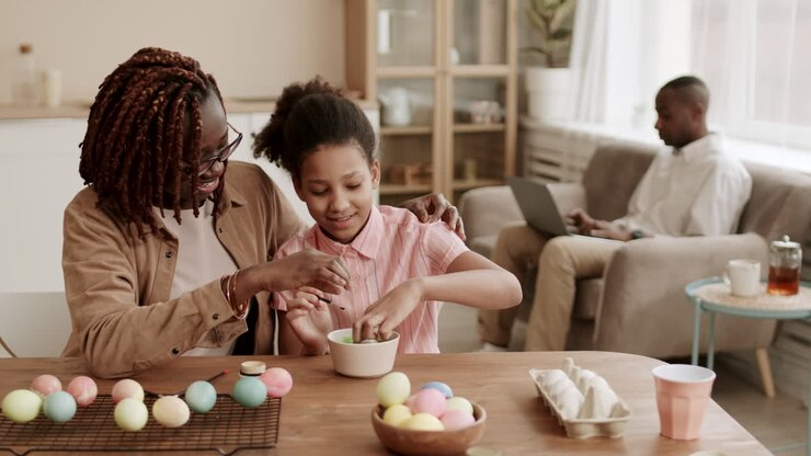 Mother and Daughter Coloring Easter Eggs