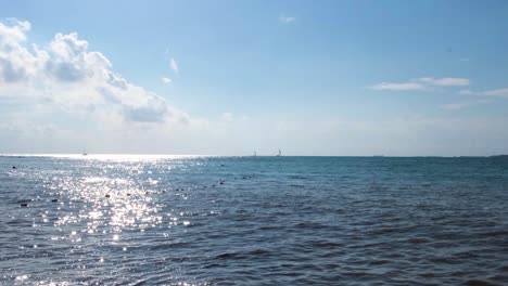 ocean view with boats and clouds