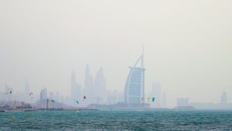 Kite-Surfing-On-Dubai-Beach-With-Burj-Al-Arab-Hotel-In-Cityscape-Background-At-United-Arab-Emirates