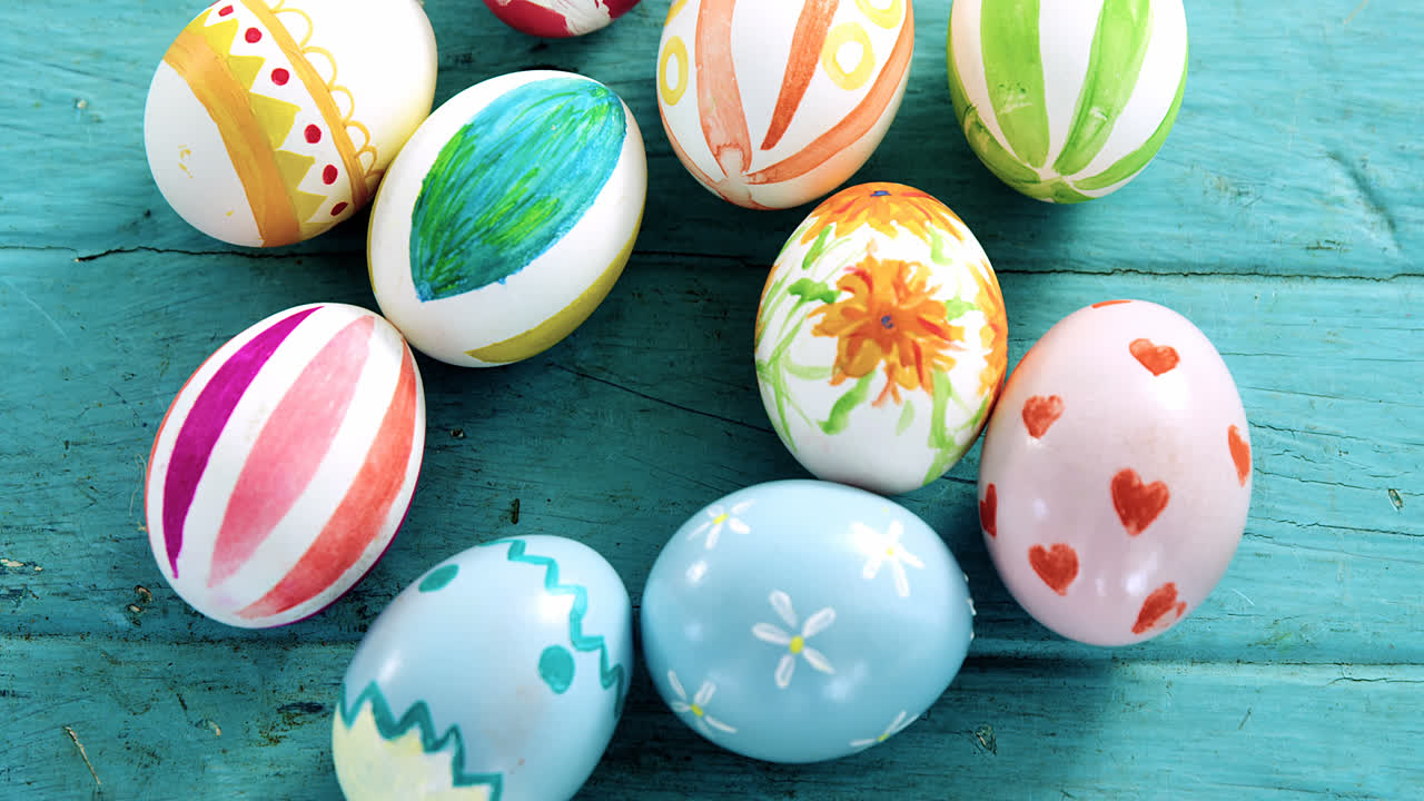 Painted Easter eggs on wooden surface