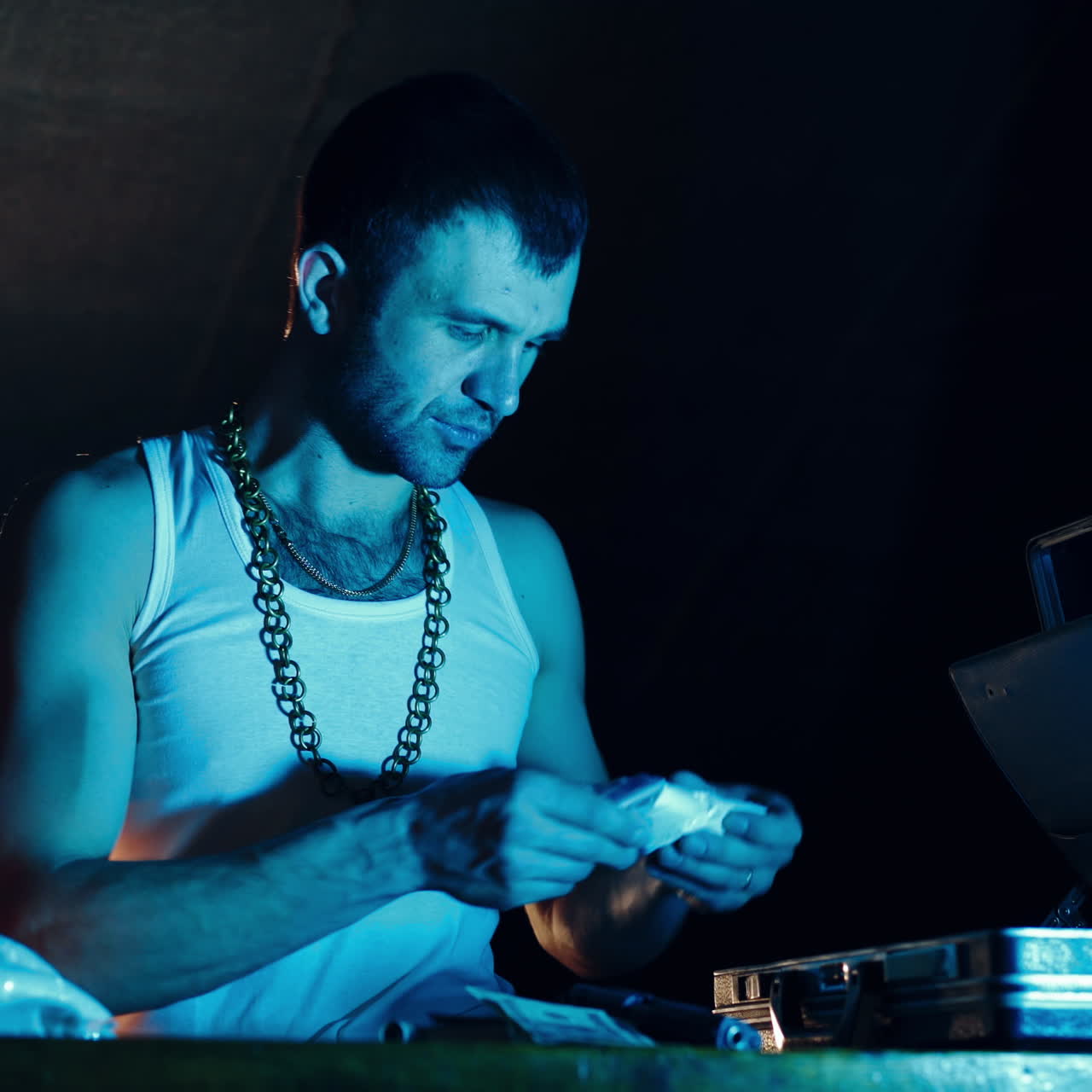 Brutal Drug Dealer Takes Packed Drug Brick out of the Suitcase and Cuts it with a Knife to try a Sample. Square video