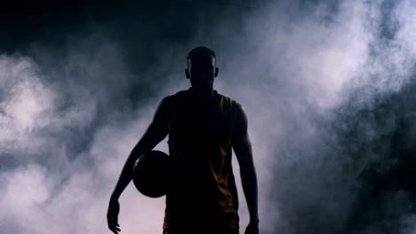 sportsman walking in basketball court