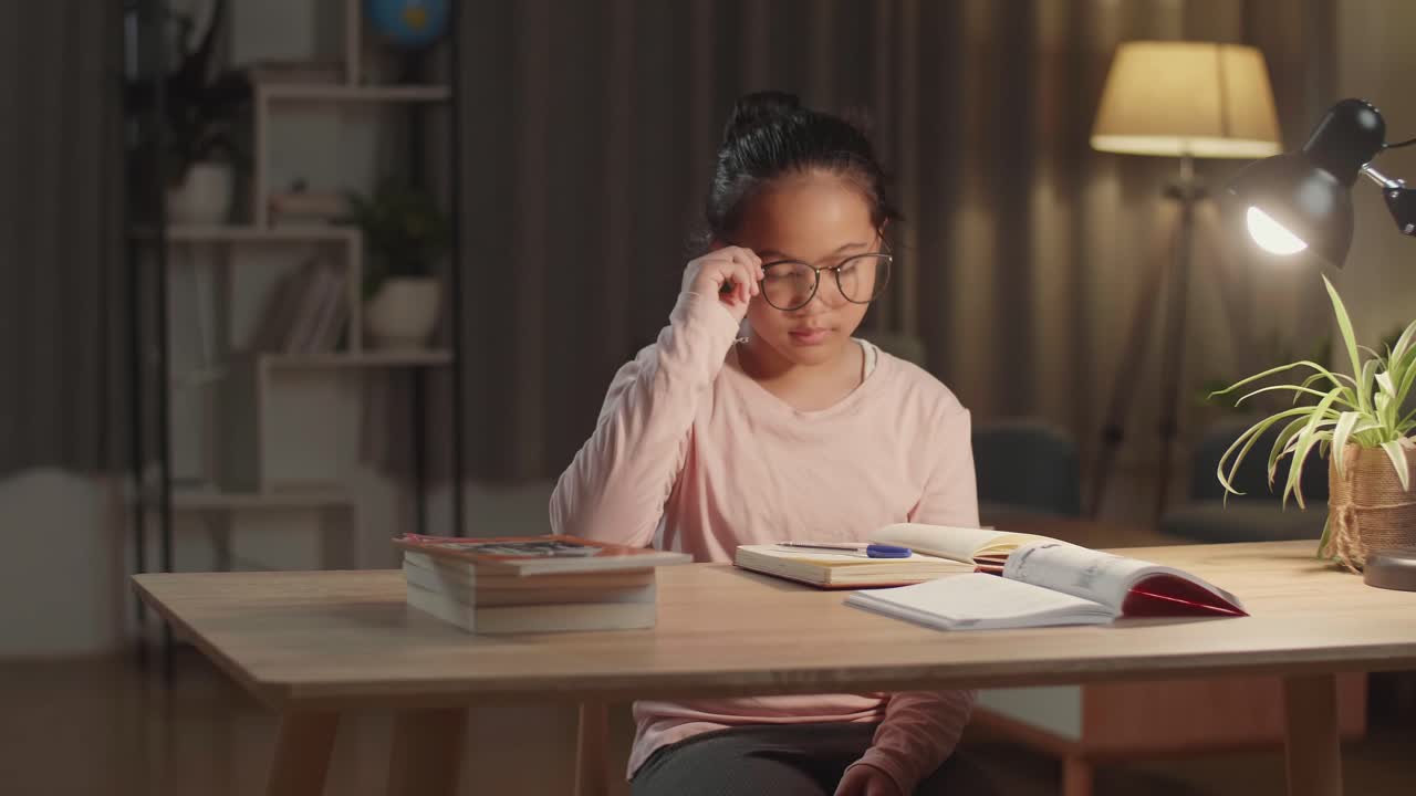 Asian Child Doing Homework And Headache At Night